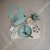 Mushie Kwiatek Press Toy Dried Thyme/Natural/Shifting Sand